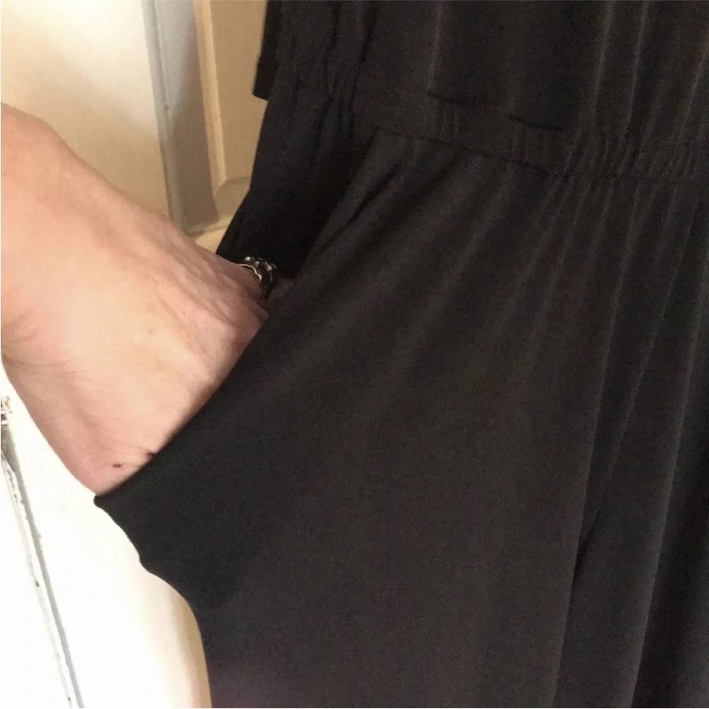 Micheal Kors size medium black long sleeve jumpsuit rhinestone embellished